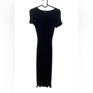 Cute casual sexy black ribbed t-shirt dress with slit at front.